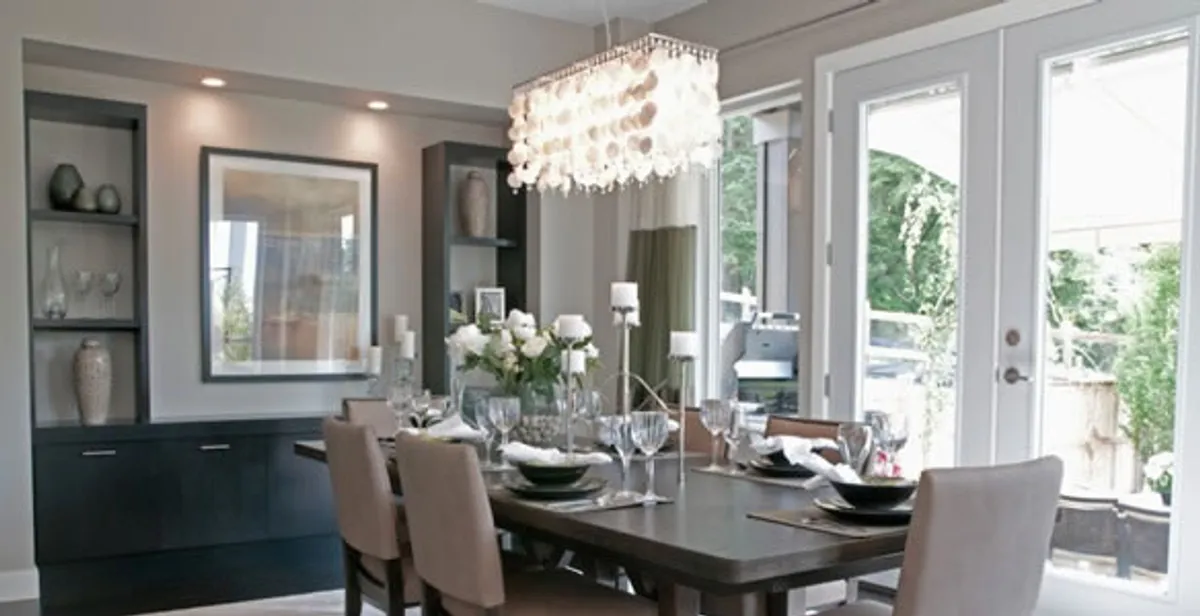 Elegant dining room chandelier installation above table in Stockton, CA