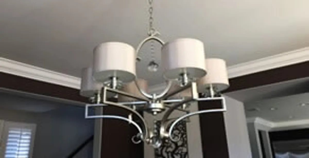 Modern chandelier installation with multiple light fixtures in Stockton, CA
